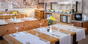 a restaurant with tables and chairs