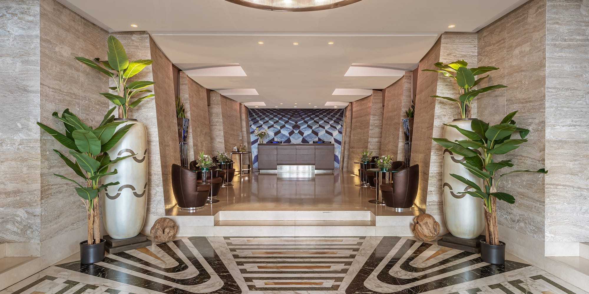 a large hall with plants in pots