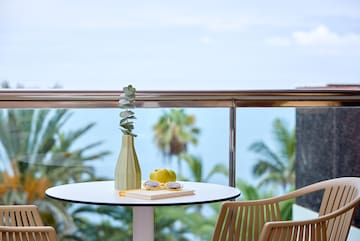 a table with a vase and glasses on it