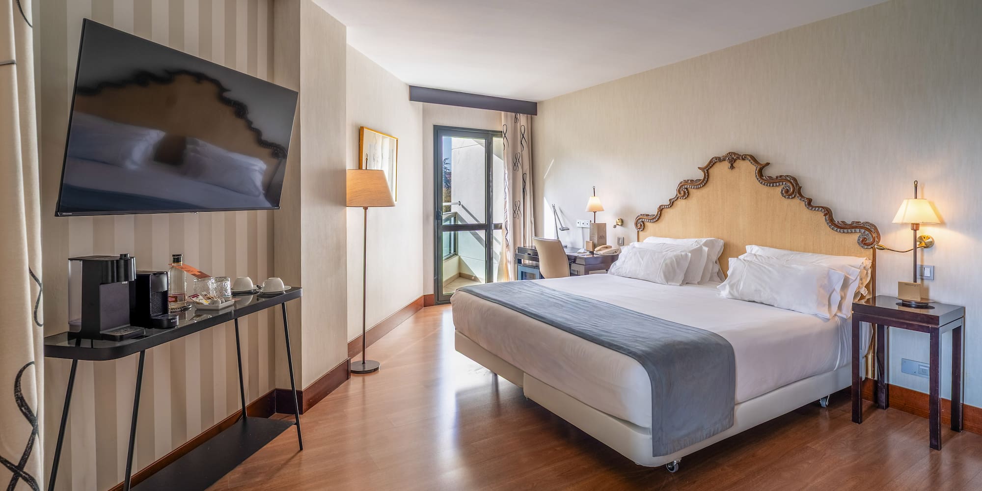 a room with a bed and a television