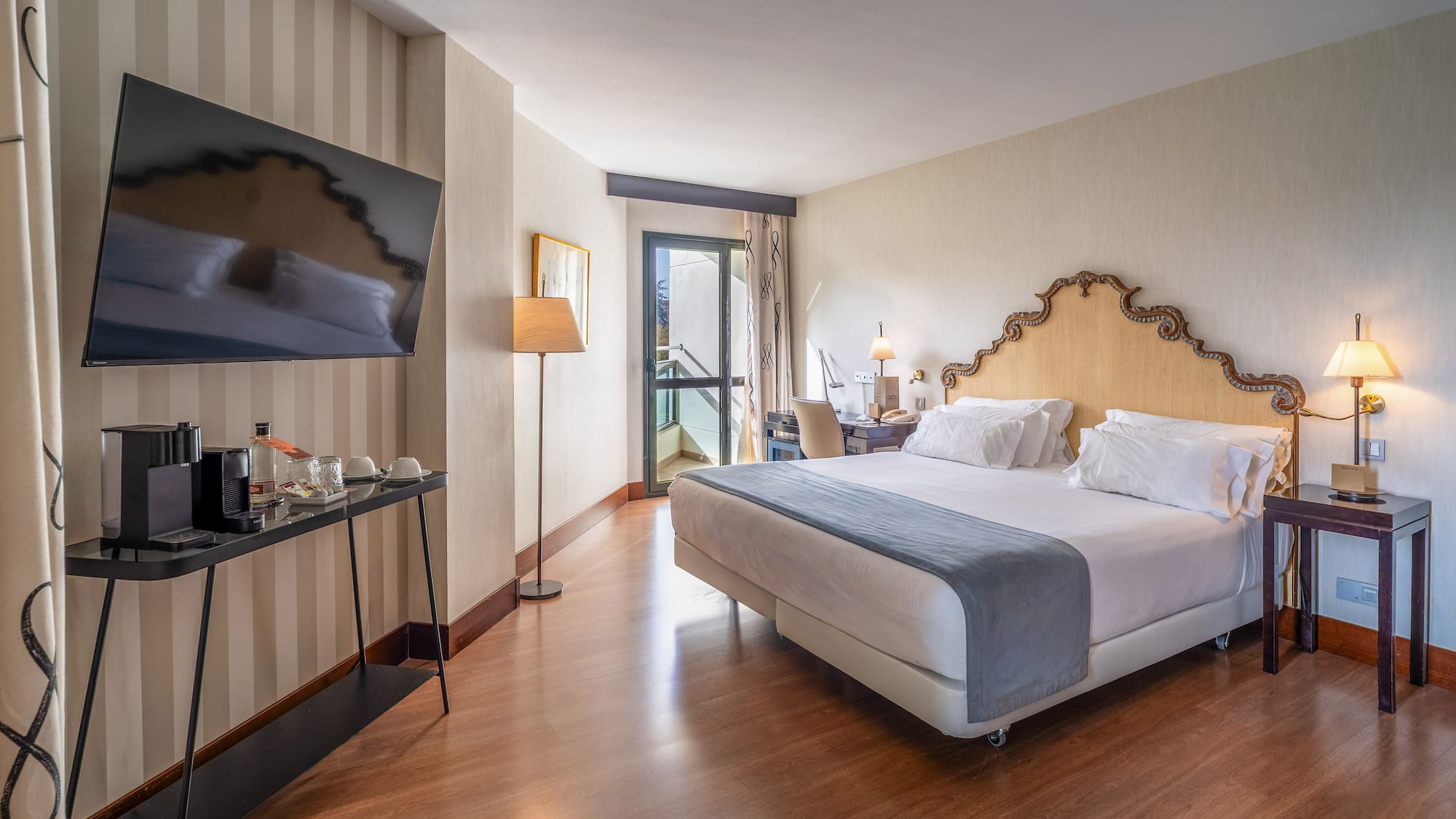 a room with a bed and a television