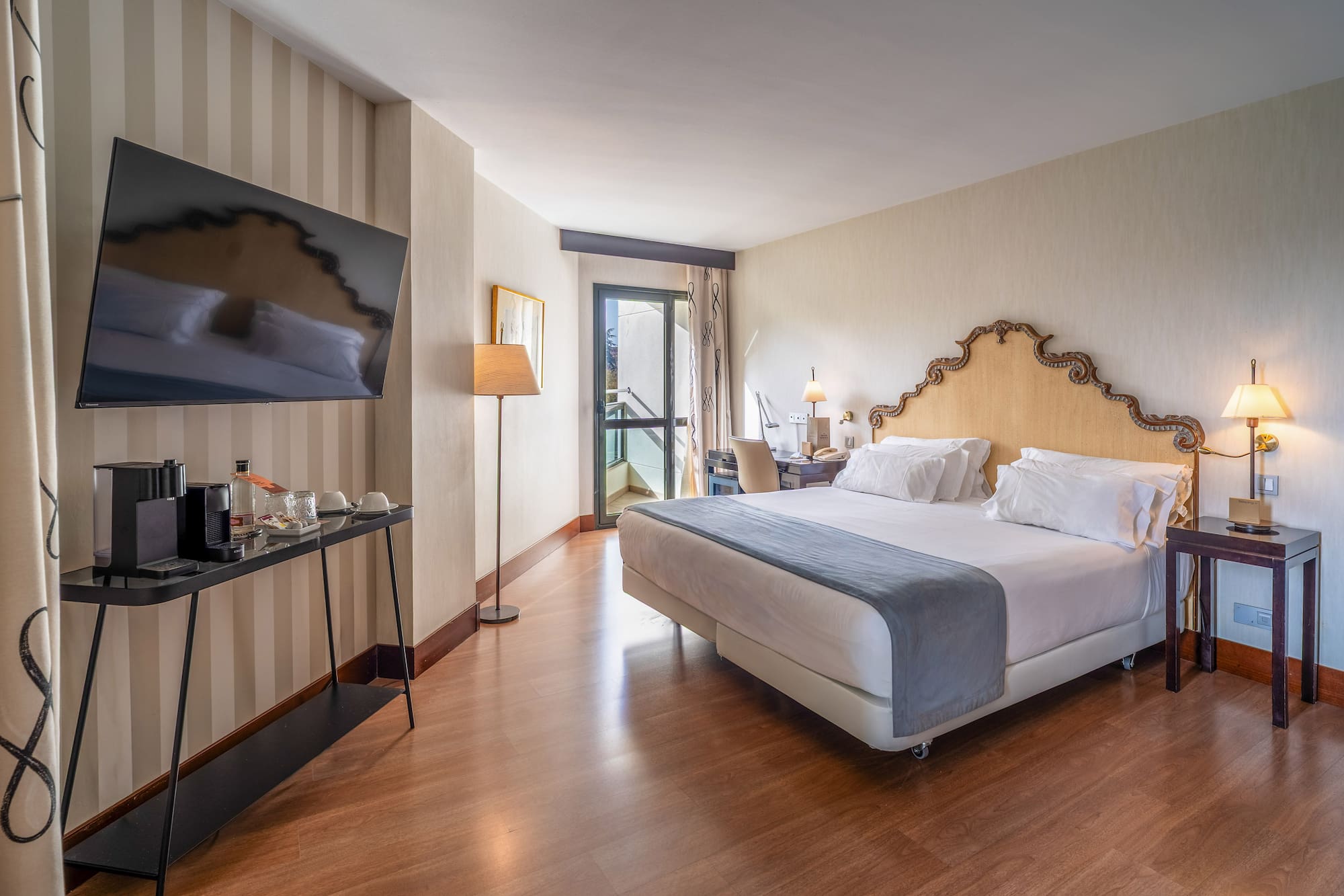 a room with a bed and a television