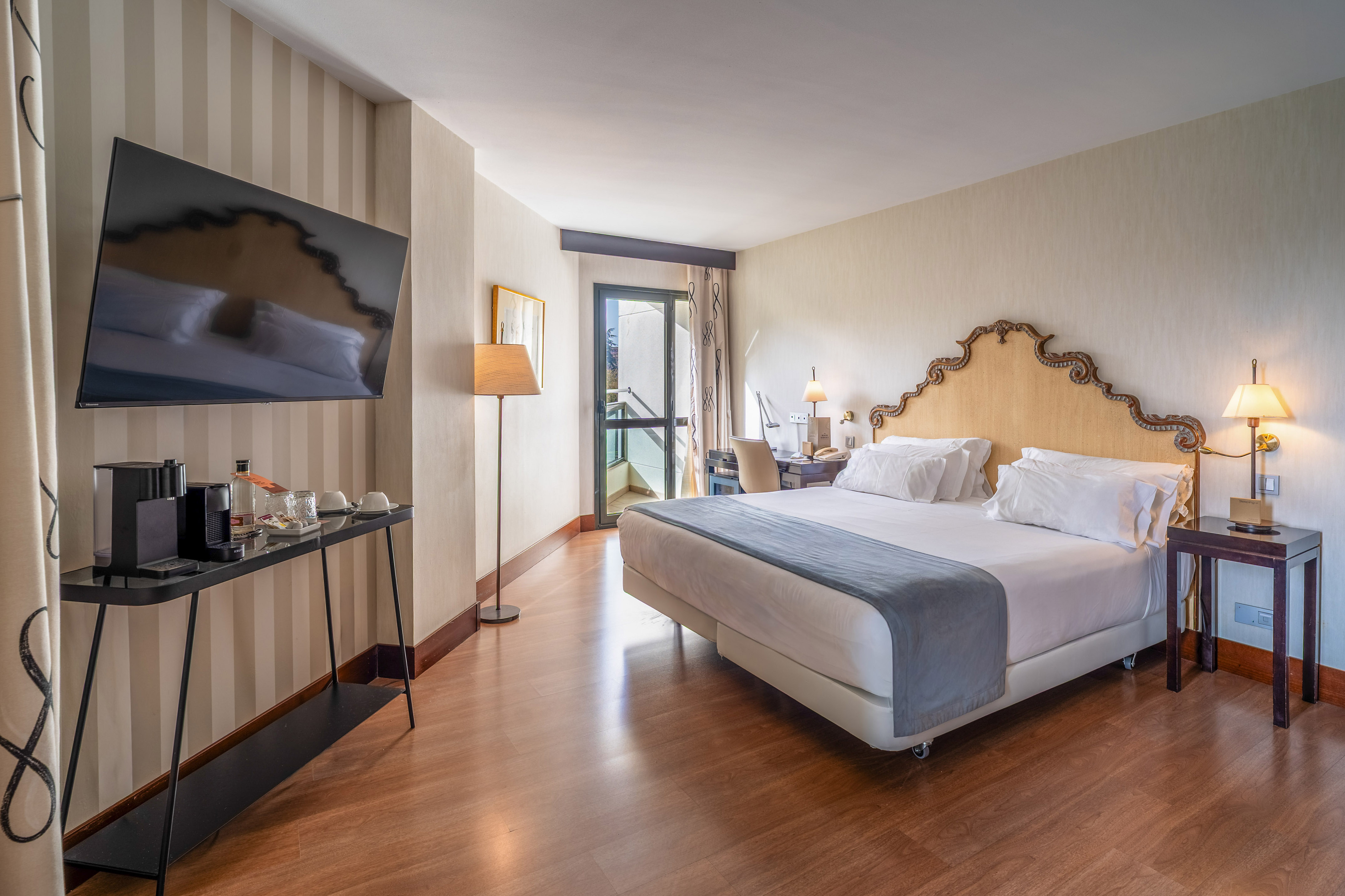 a room with a bed and a television