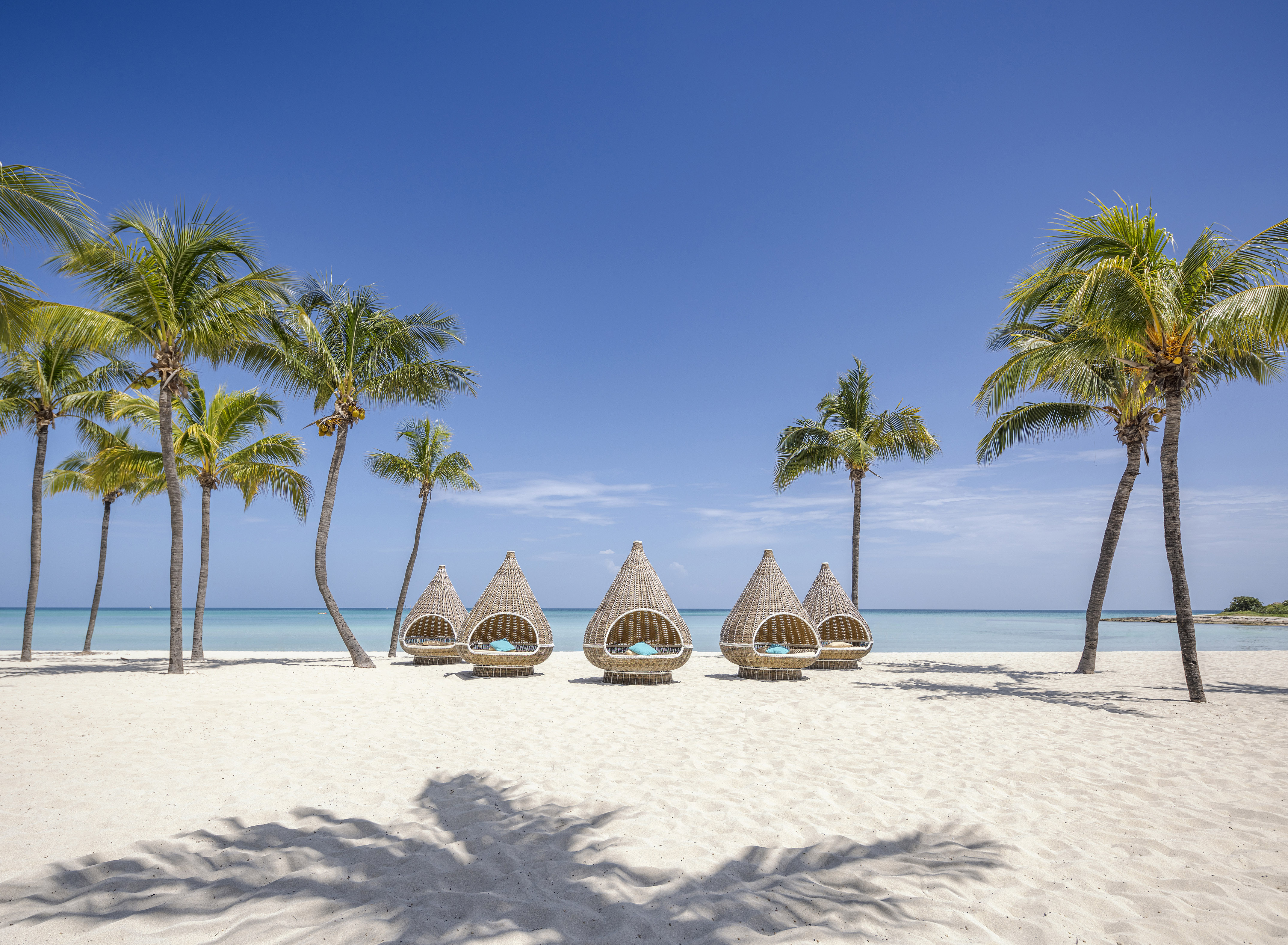a group of chairs on a beach