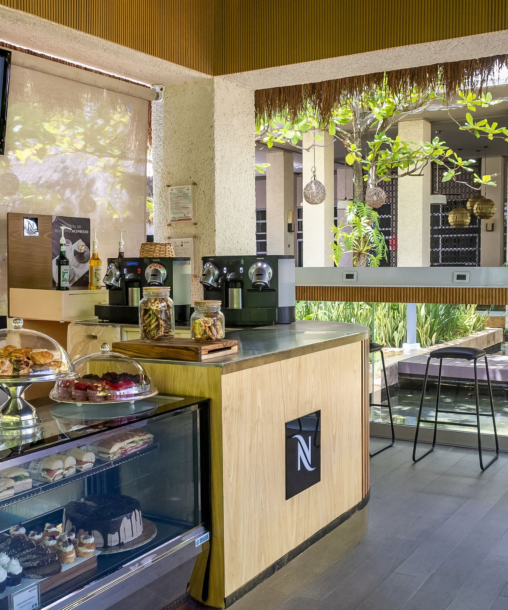 a coffee shop with a counter and a television