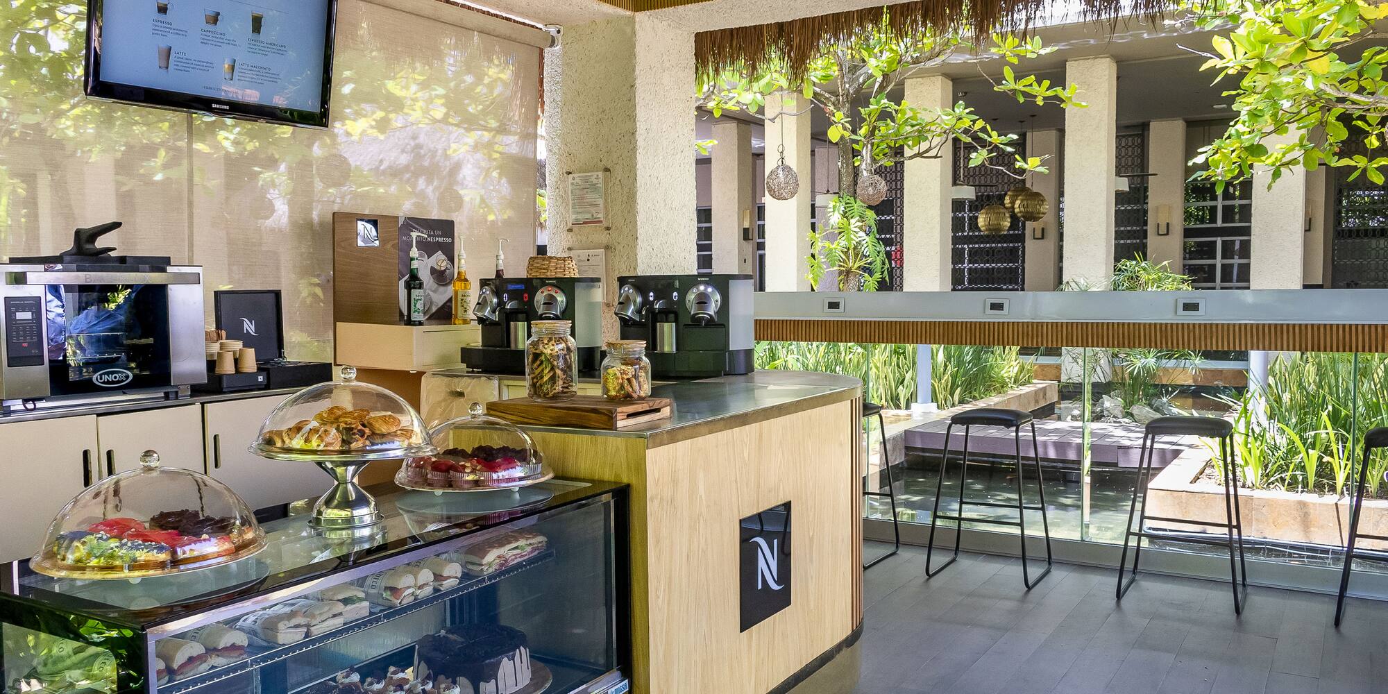 a coffee shop with a counter and a television
