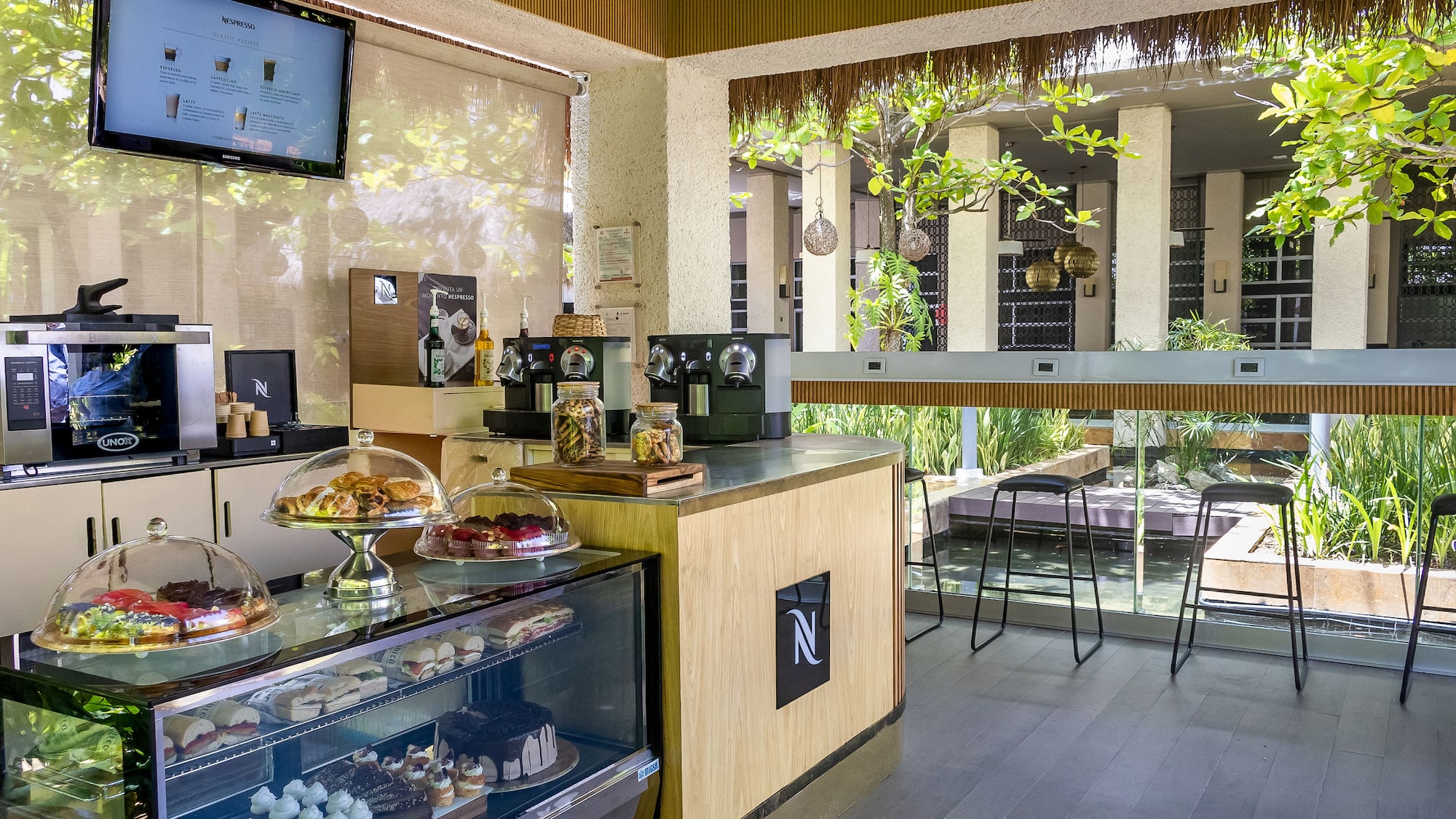 a coffee shop with a counter and a television
