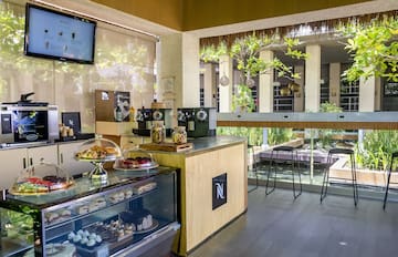 a coffee shop with a counter and a television