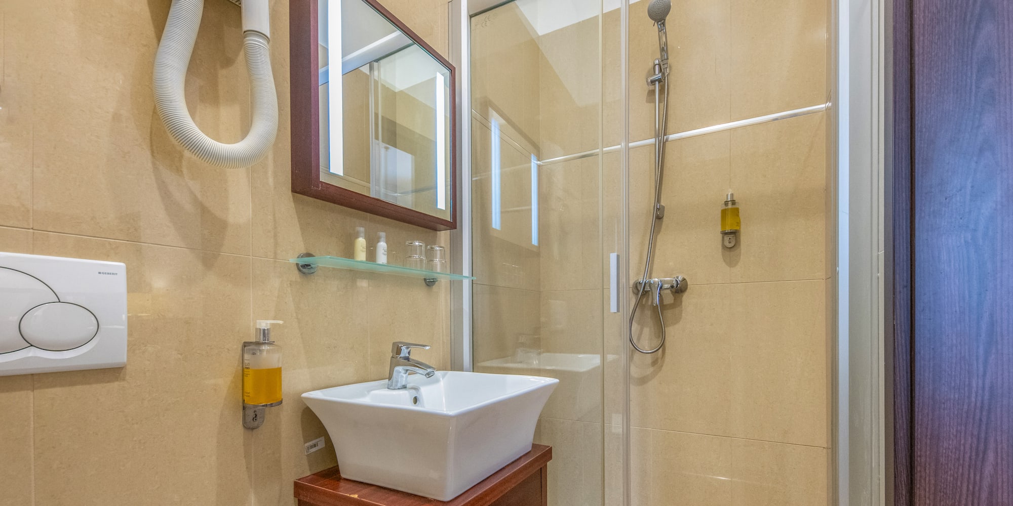 a bathroom with a shower and sink