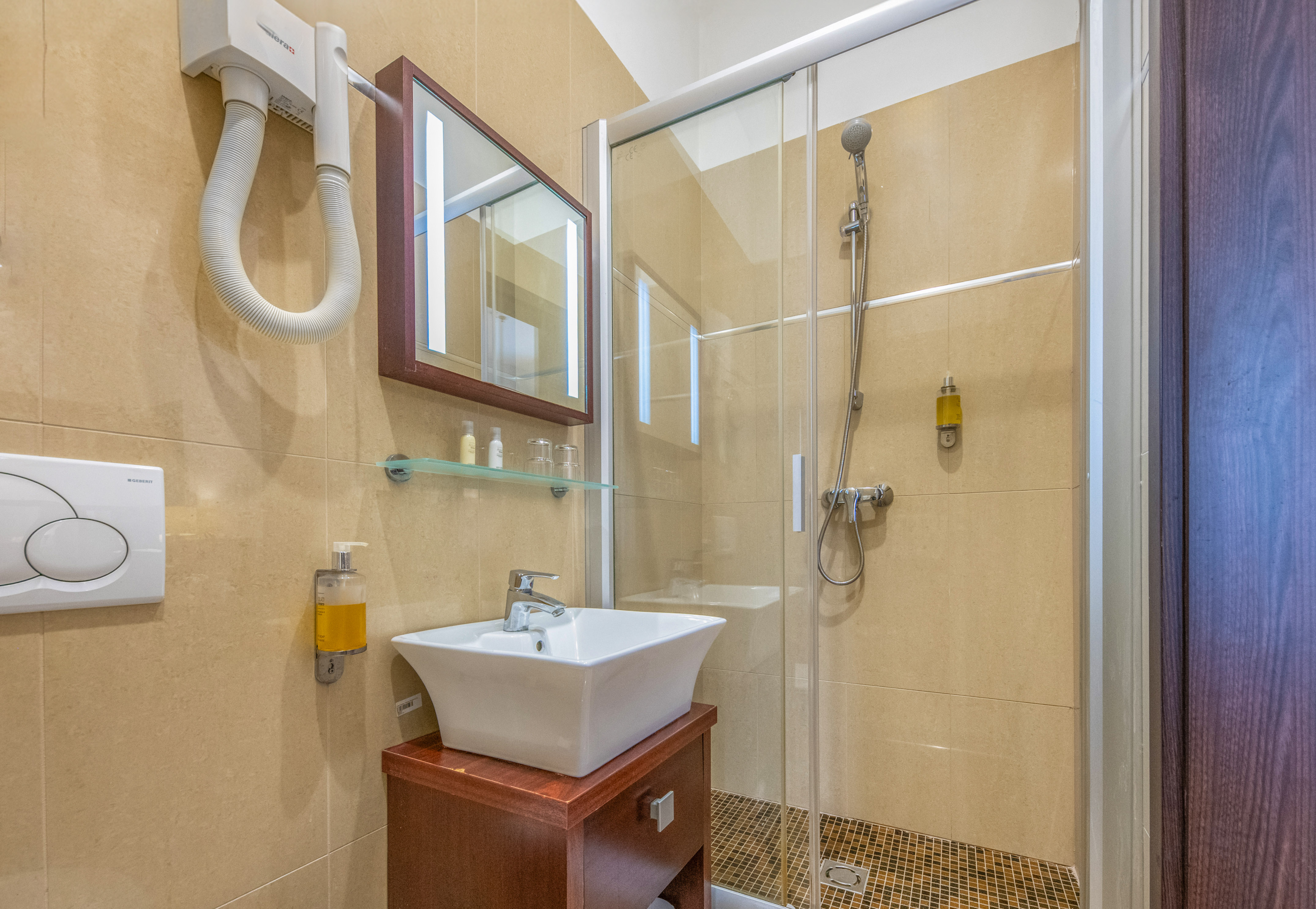 a bathroom with a shower and sink