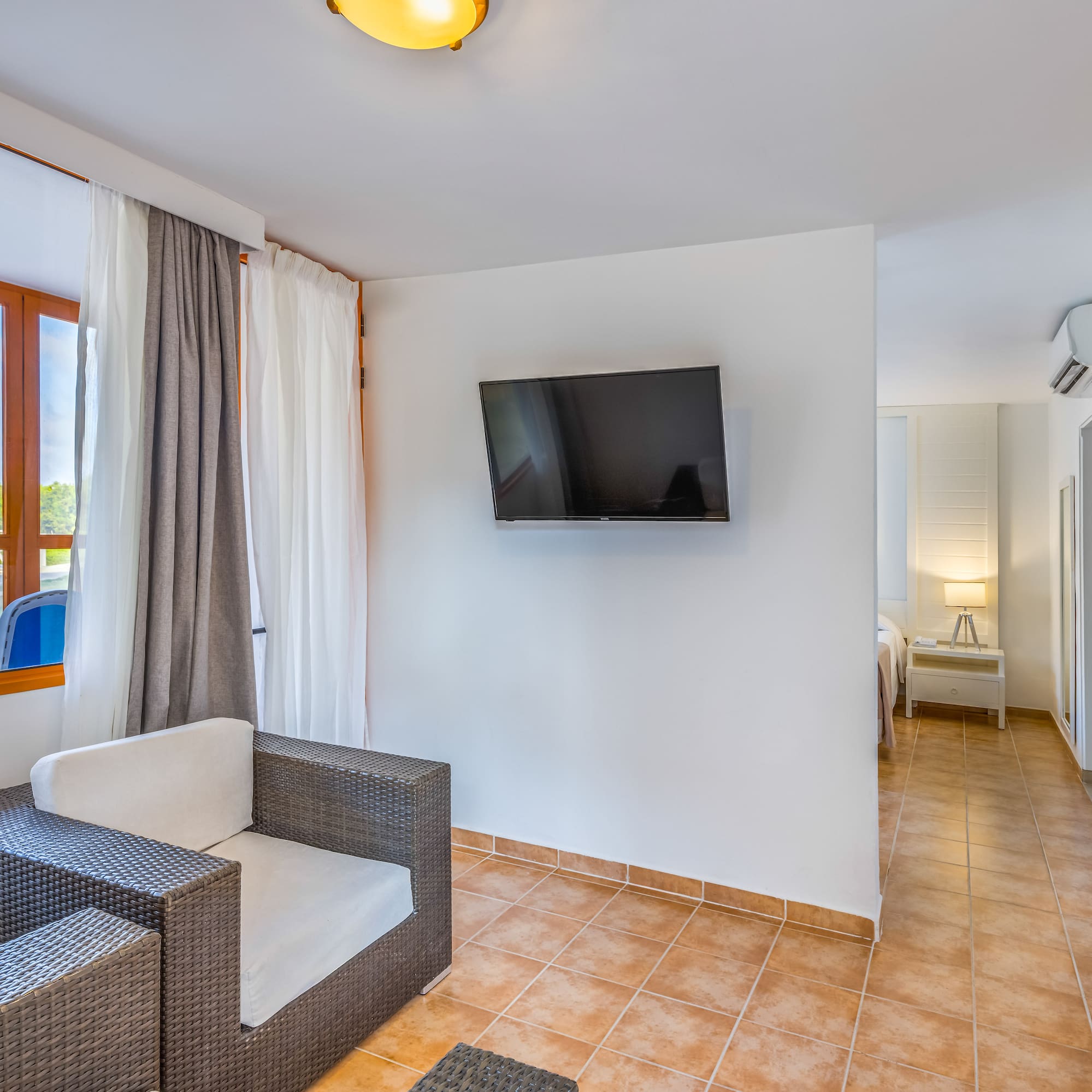 a room with a television and a chair