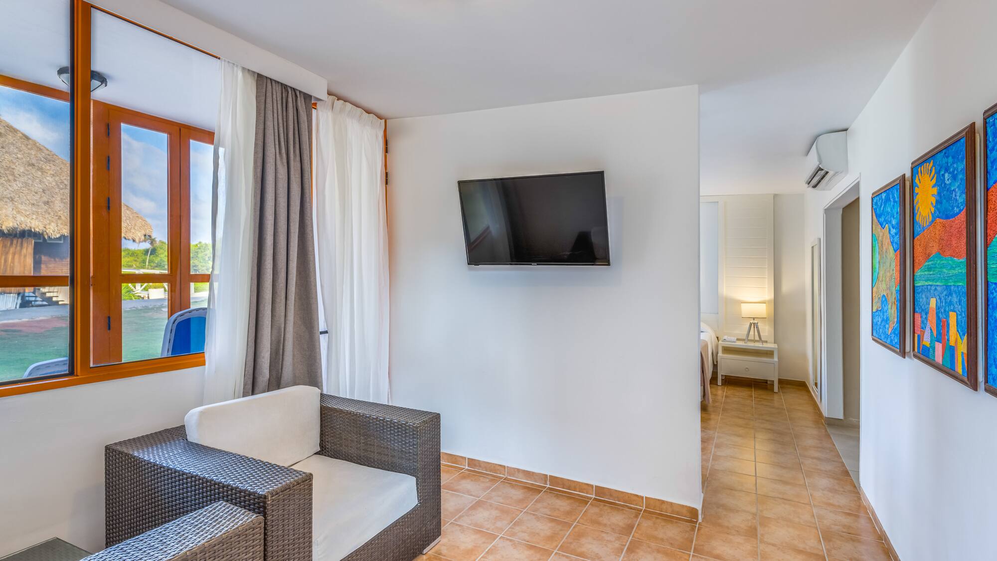 a room with a television and a chair