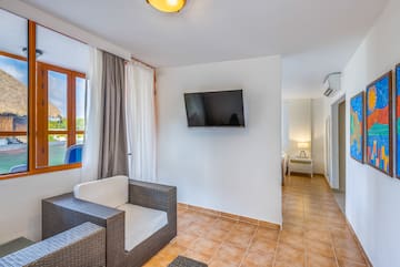 a room with a television and a chair