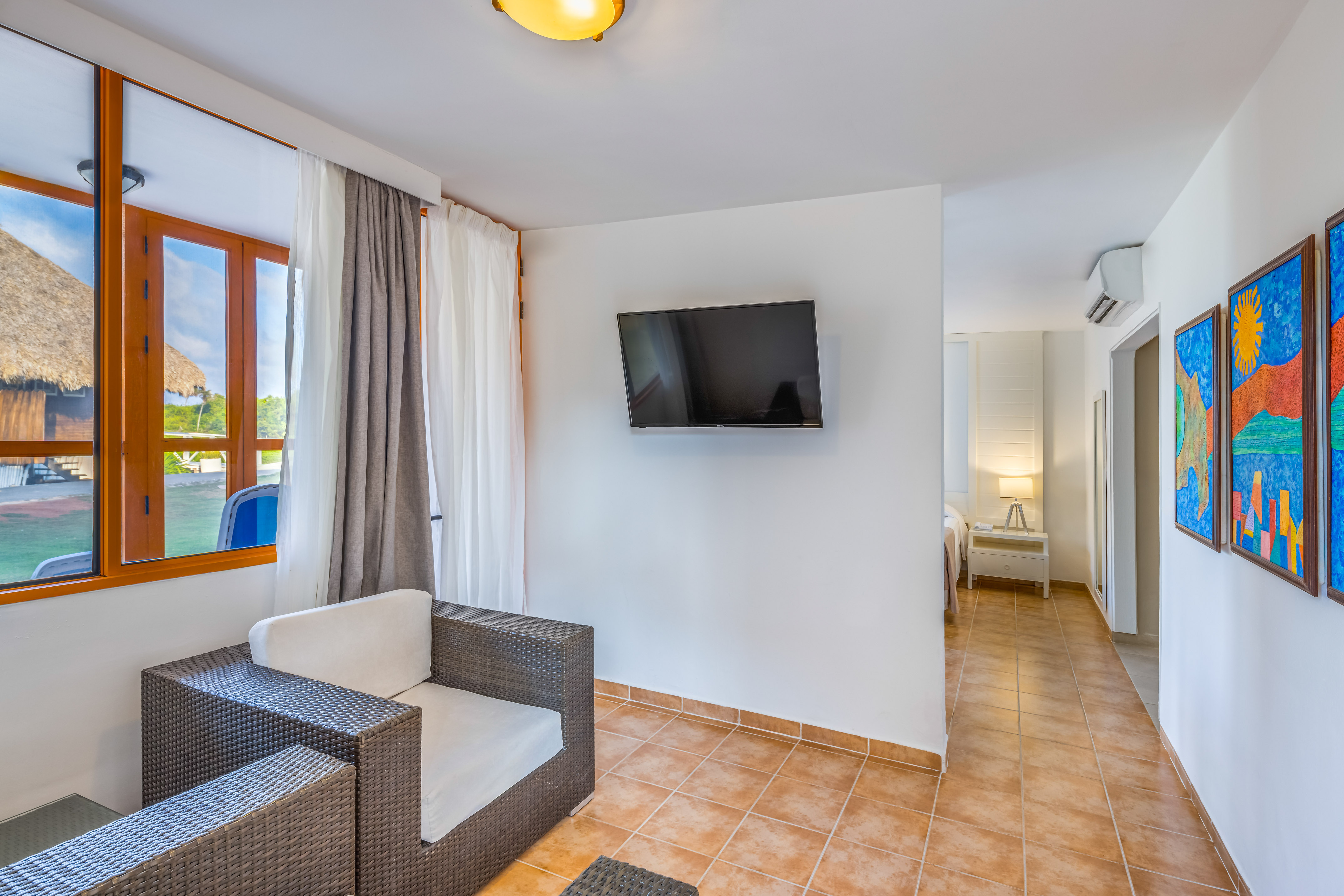 a room with a television and a chair