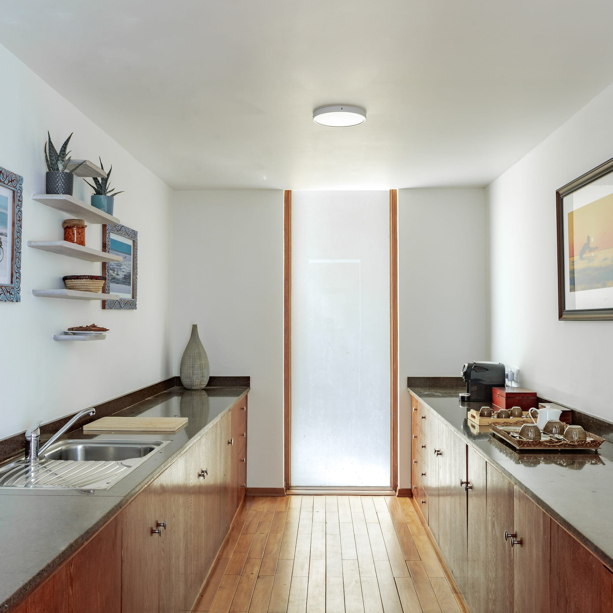a kitchen with wood cabinets and sink