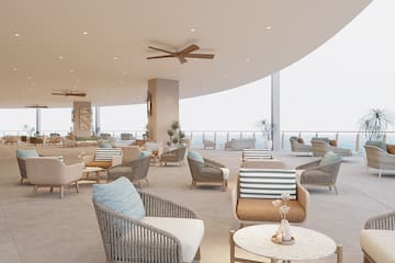 a room with chairs and a ceiling fan