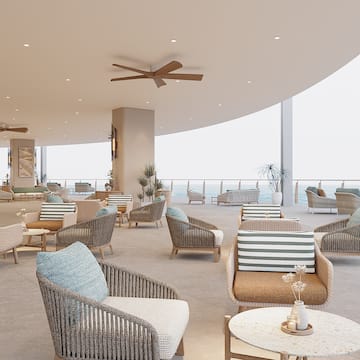 a room with chairs and a ceiling fan