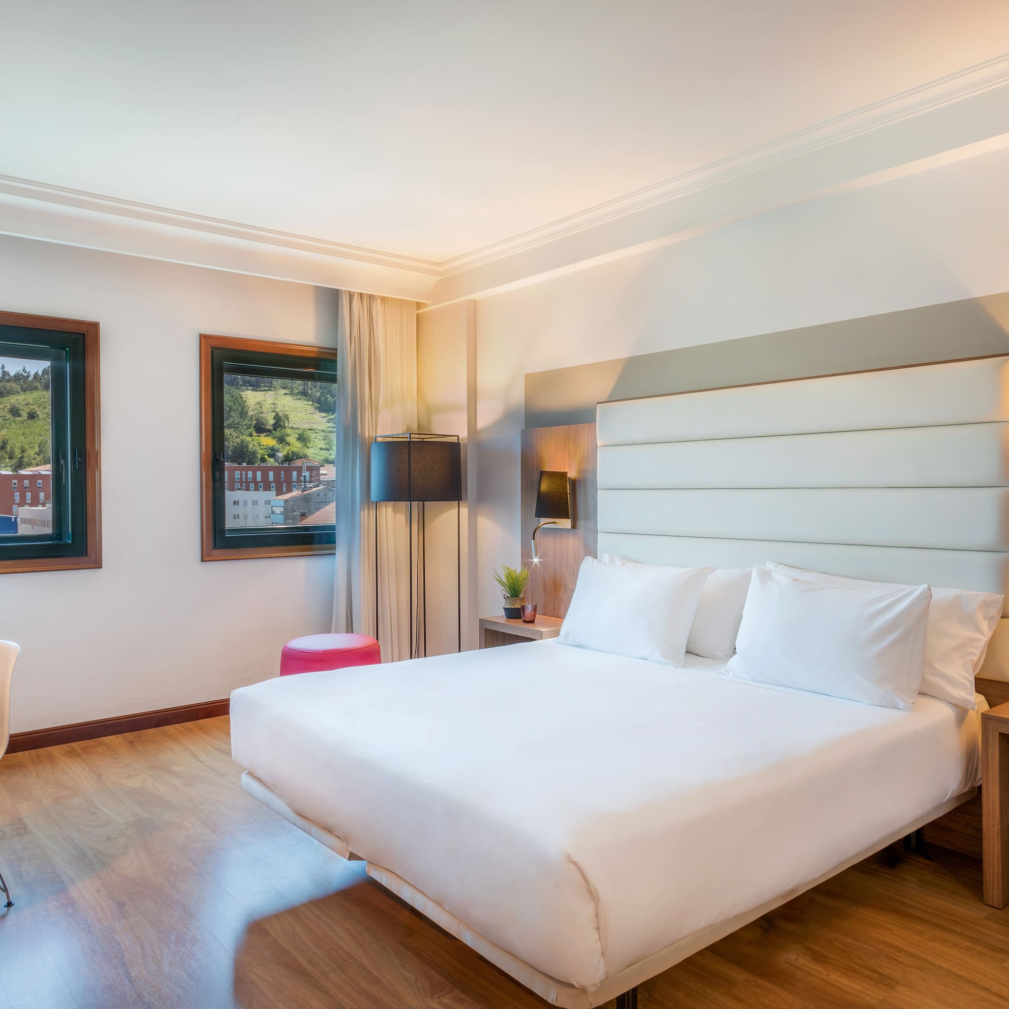 a room with a bed and a chair