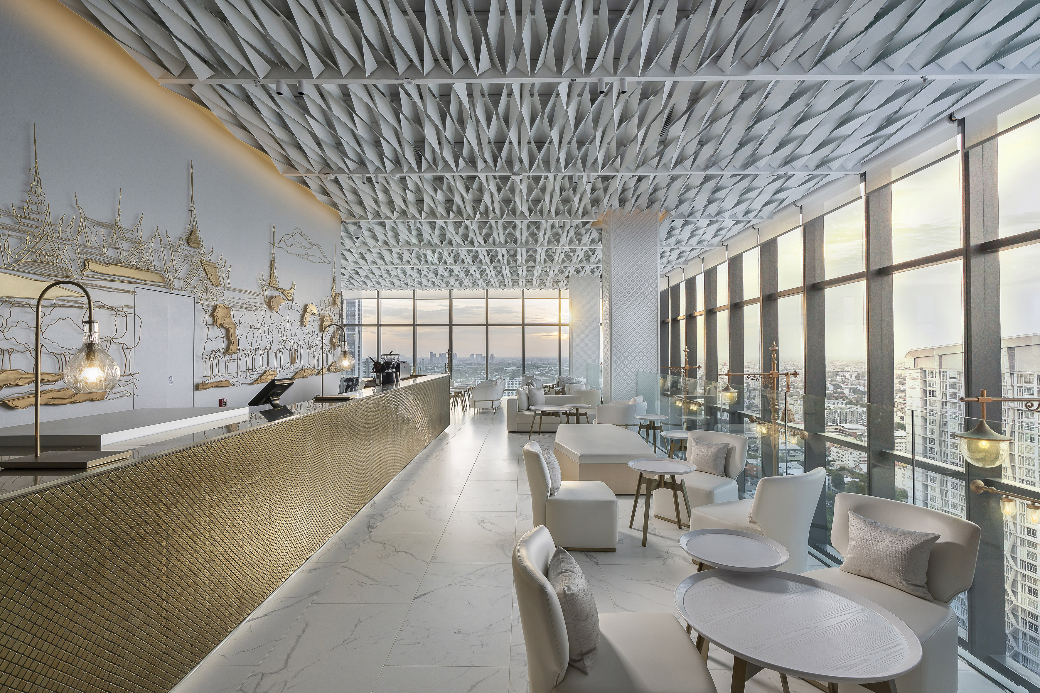 Luxury bar lounge, golden counter, geometric ceiling, panoramic city view. - INNSiDE Bangkok Sukhumvit, Bangkok