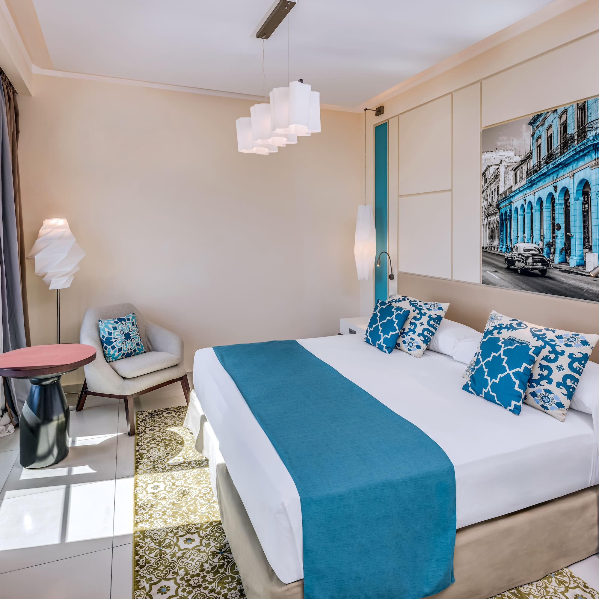 a bedroom with a bed and chair