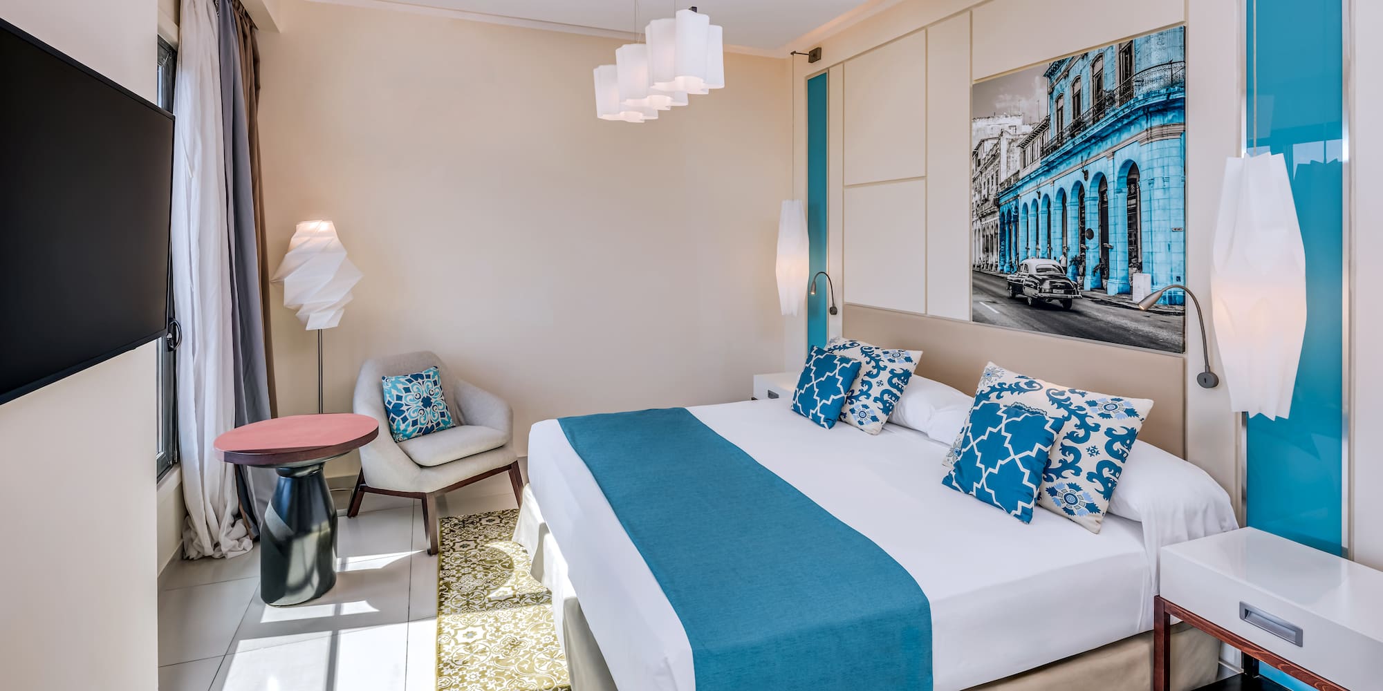 a bedroom with a bed and chair