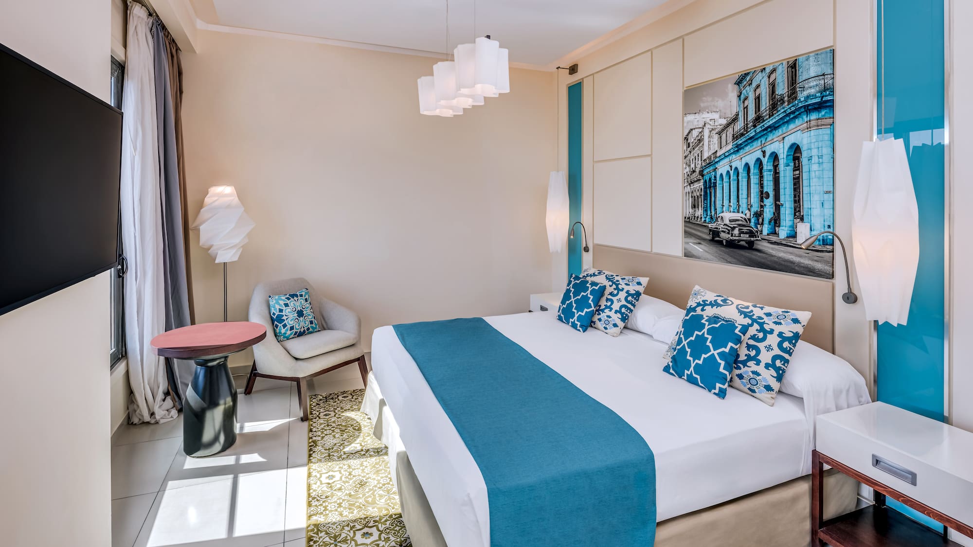 a bedroom with a bed and chair