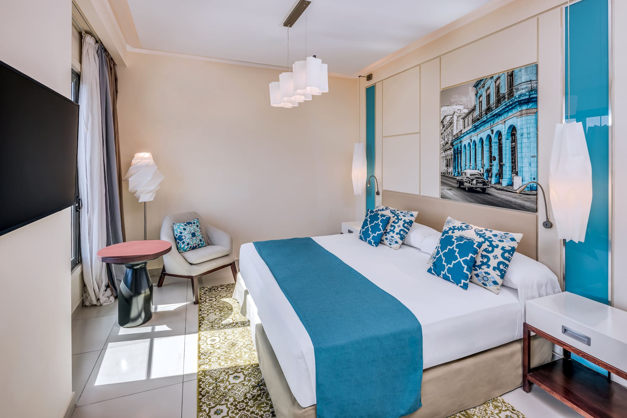 a bedroom with a bed and chair