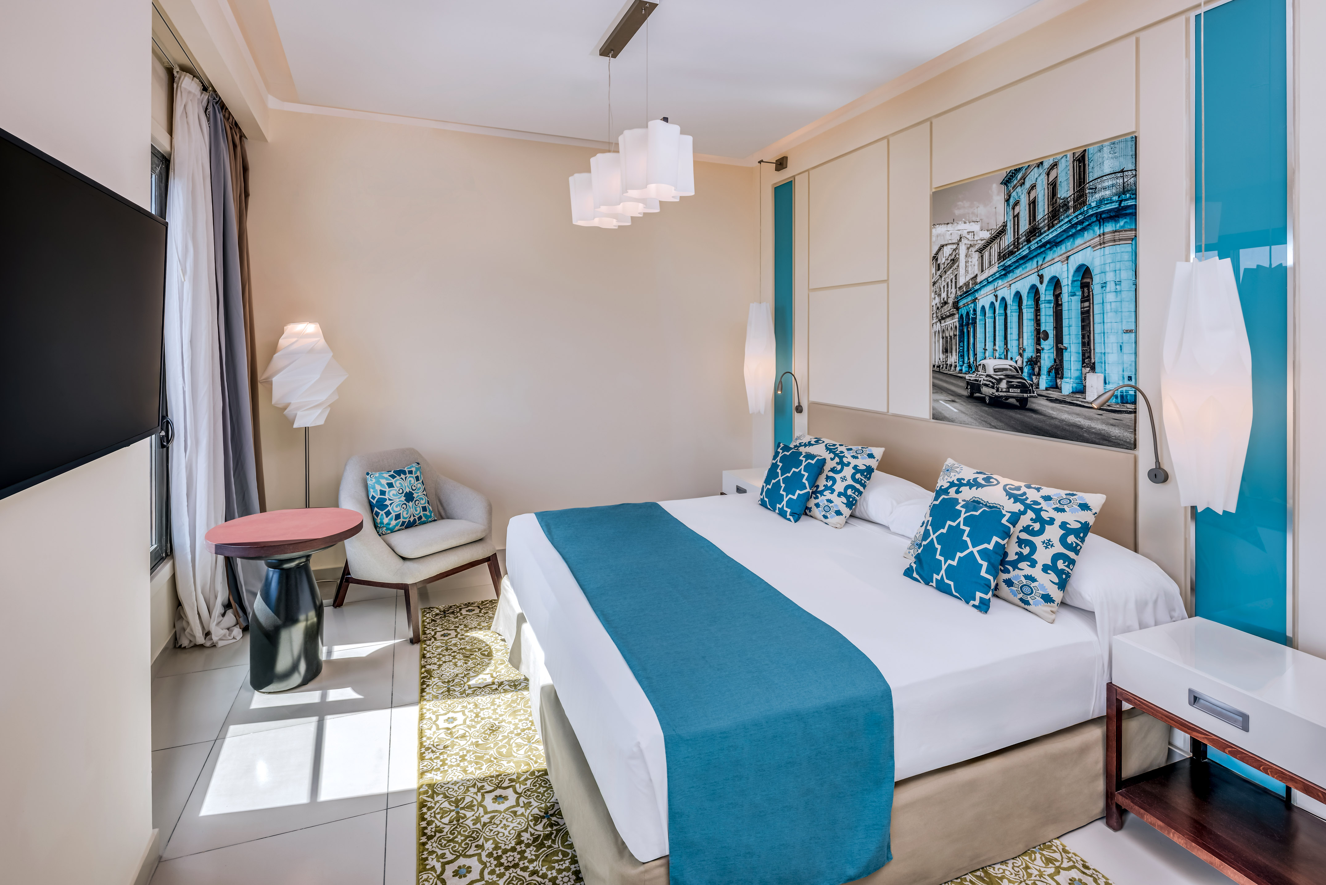 a bedroom with a bed and chair