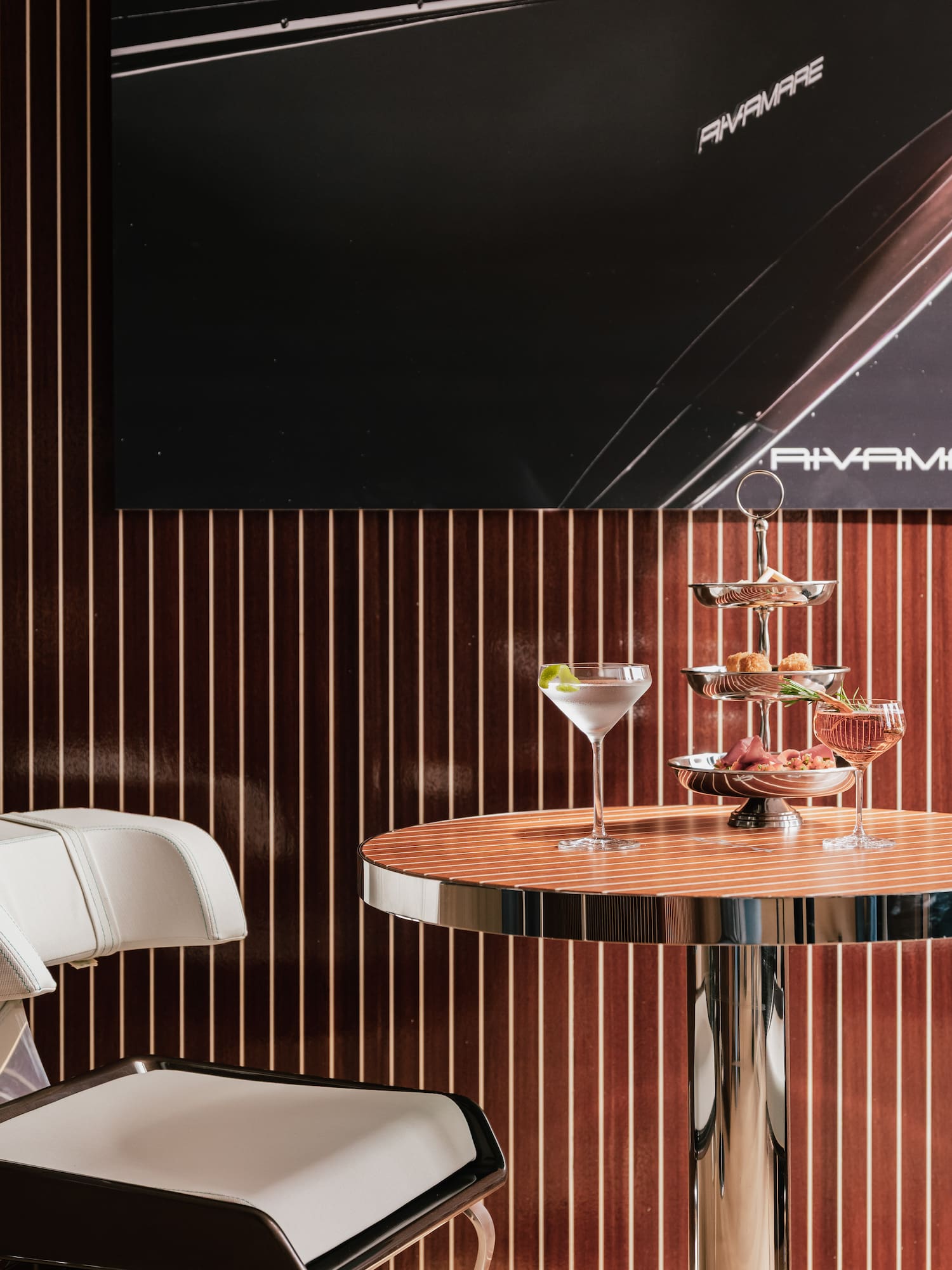 a three tiered tray of drinks on a table