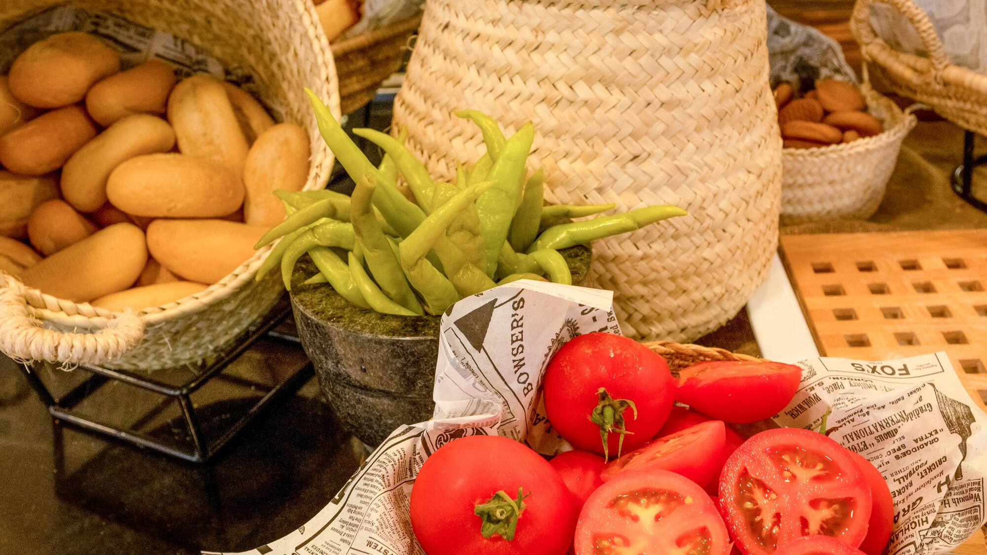 a basket of tomatoes and peppers