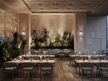 a room with tables and chairs and plants