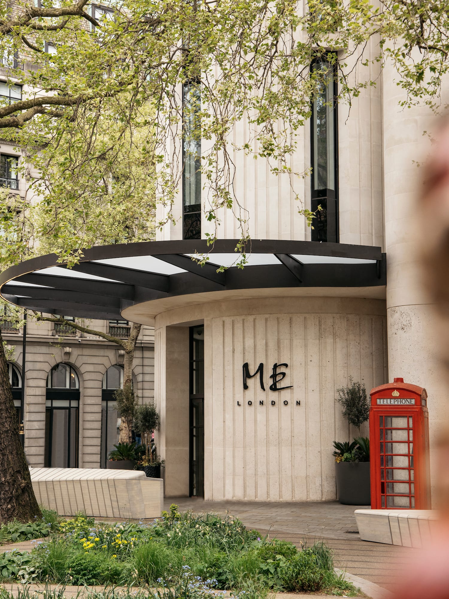 a building with a red telephone booth