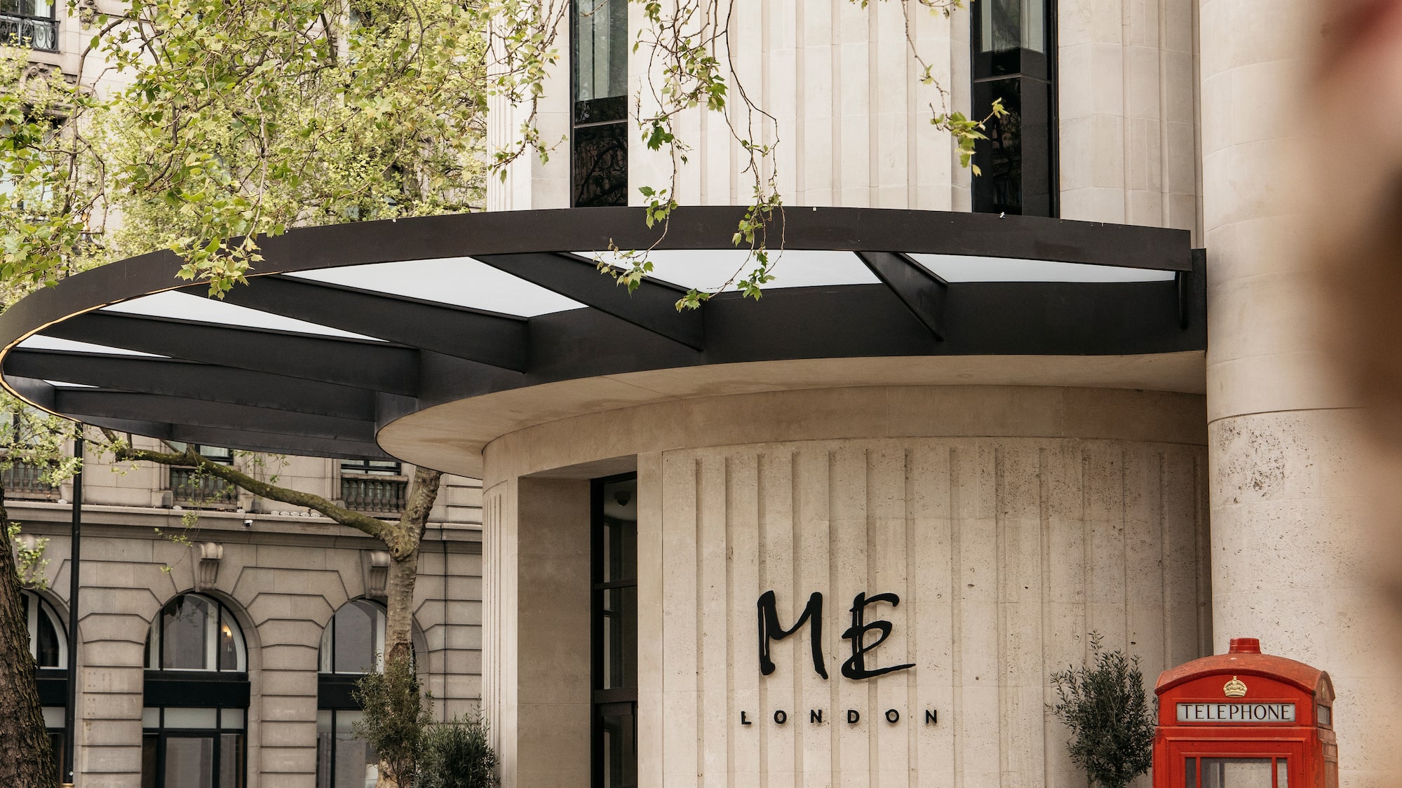 a building with a red telephone booth