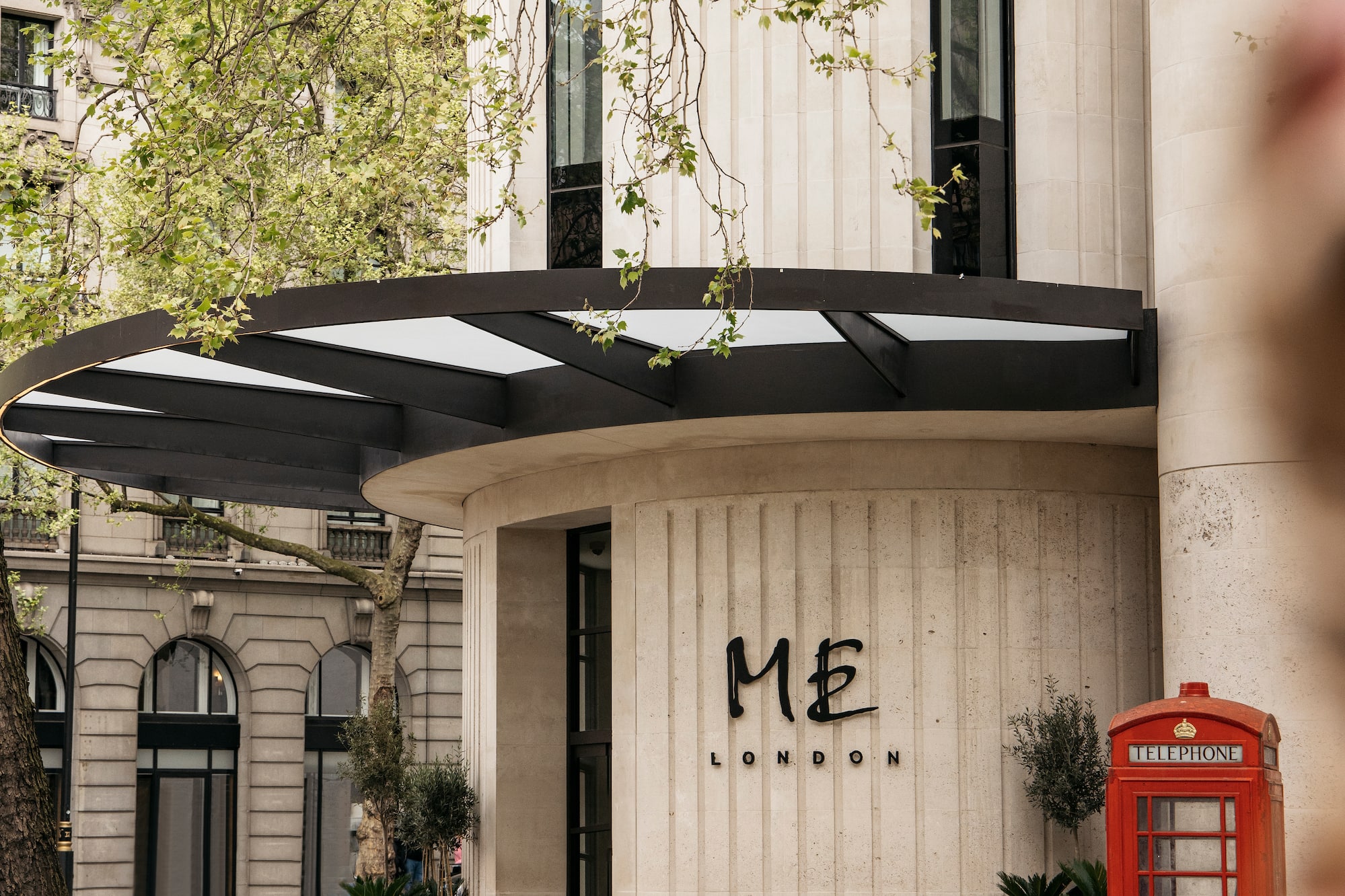 a building with a red telephone booth