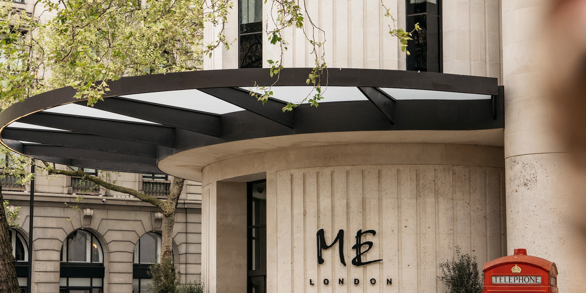a building with a red telephone booth