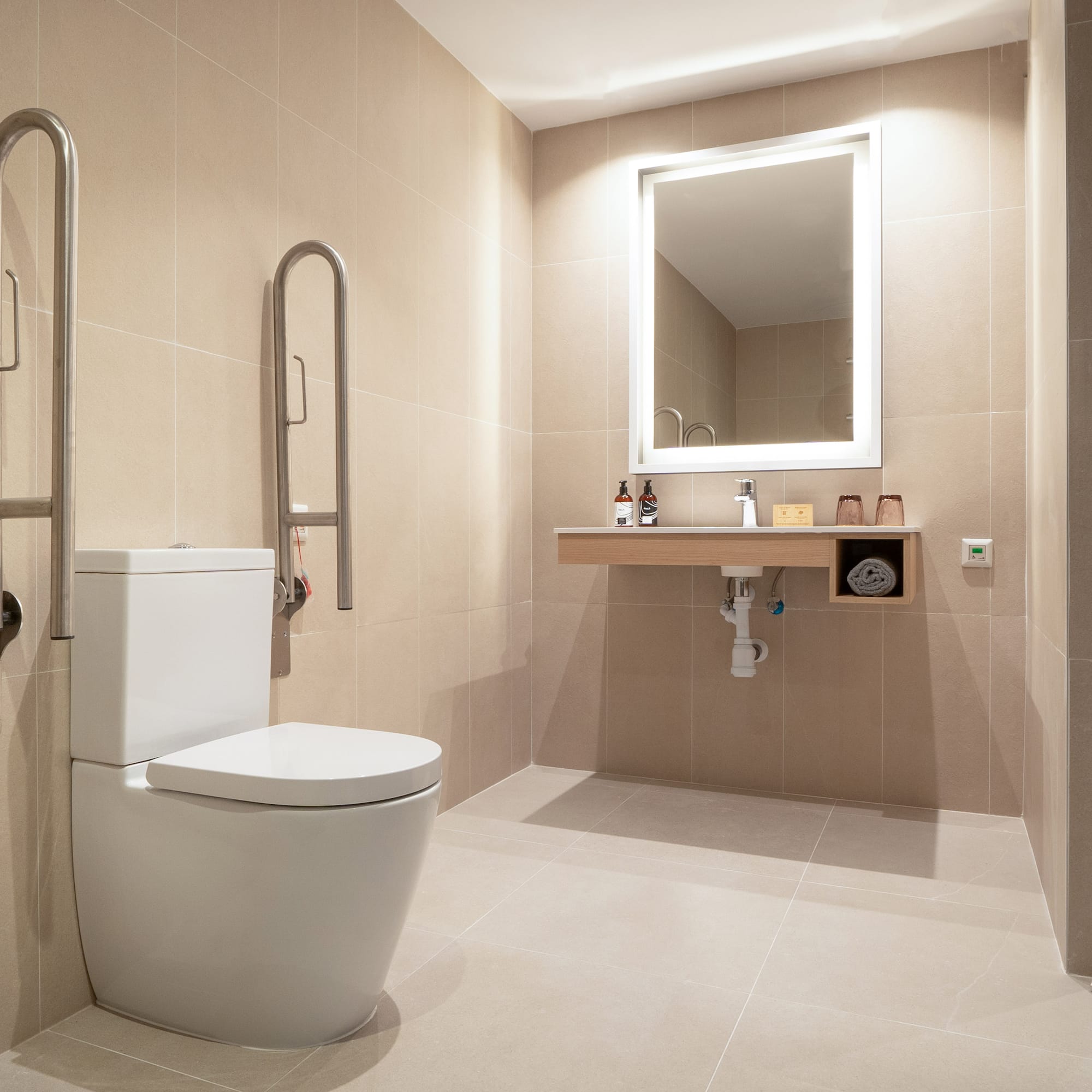 a bathroom with a toilet and a mirror