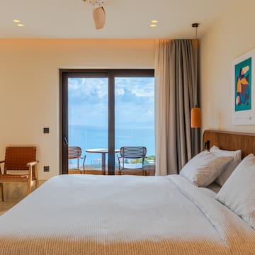 a bed with a view of the ocean
