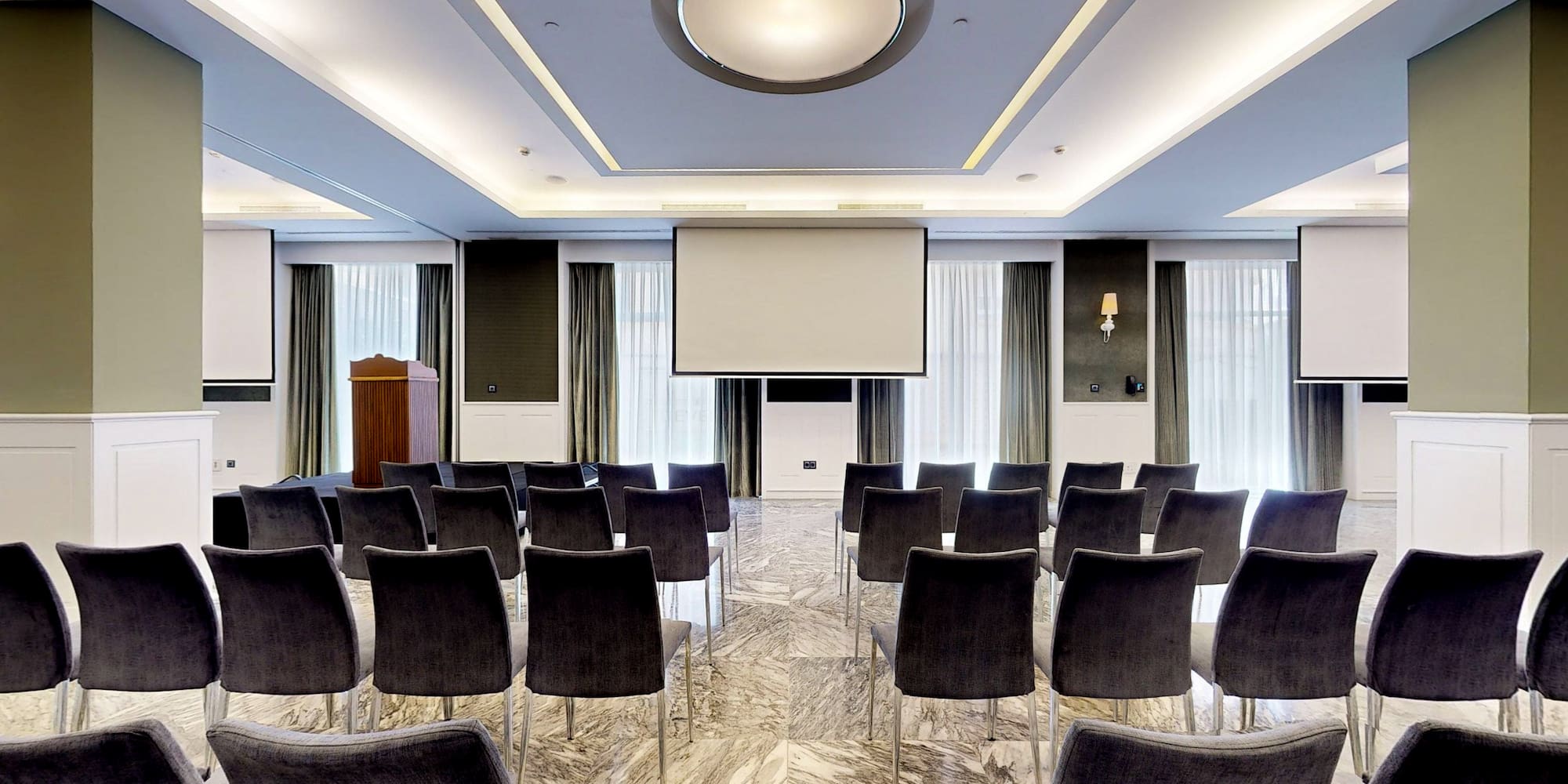 a room with chairs and a podium