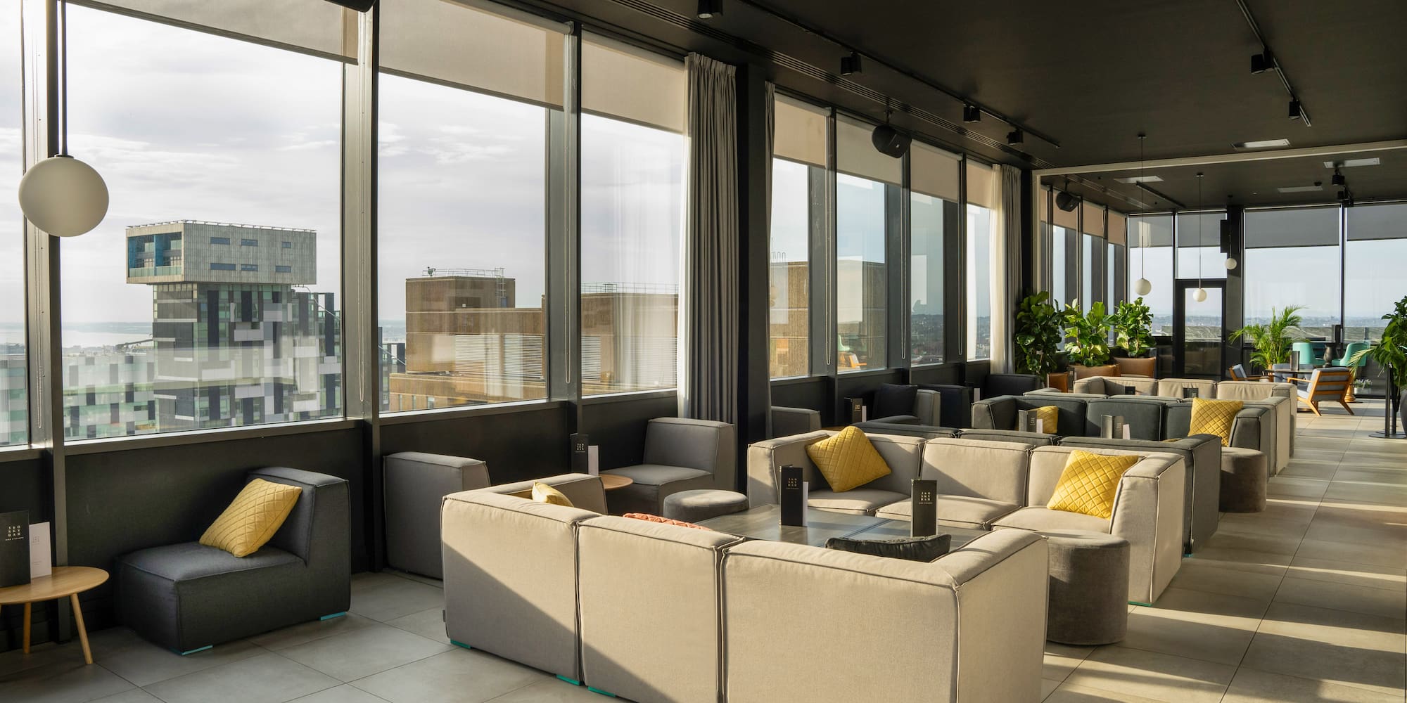 a room with couches and tables