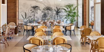 a restaurant with tables and chairs