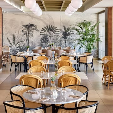 a restaurant with tables and chairs