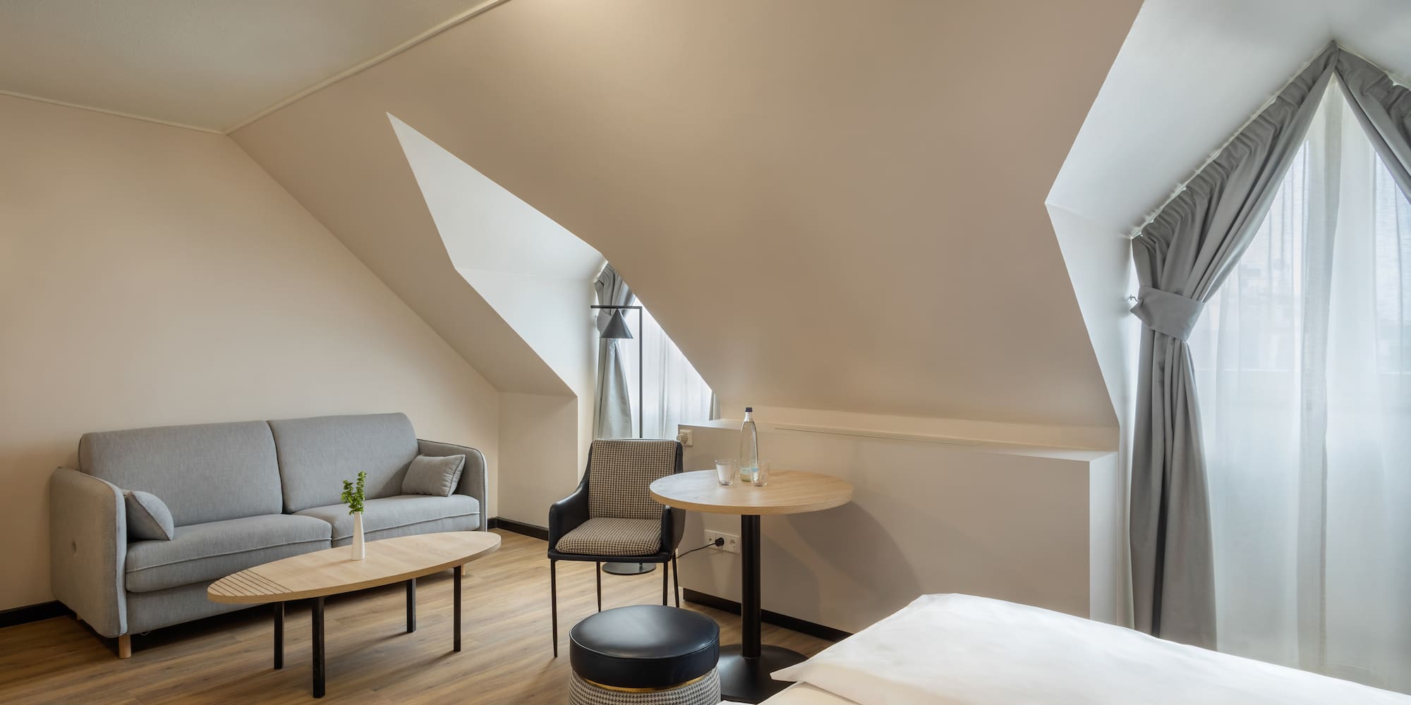 a room with a couch and a sofa