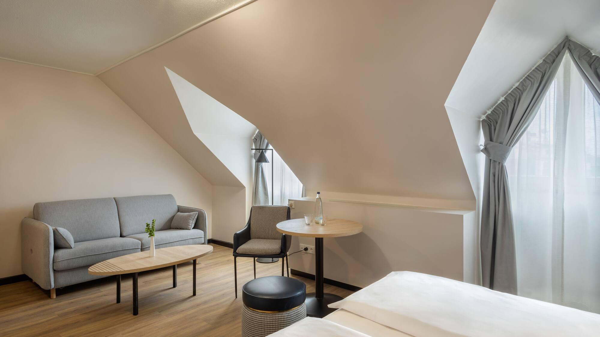 a room with a couch and a sofa