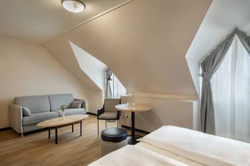 a room with a couch and a sofa