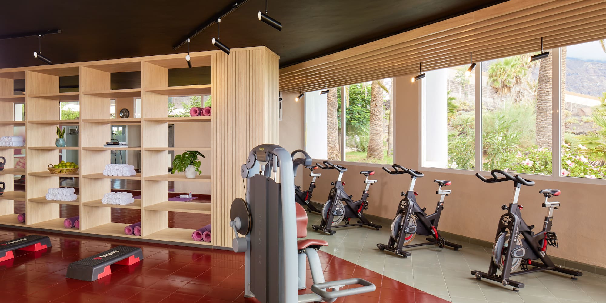 a room with exercise bikes and exercise equipment