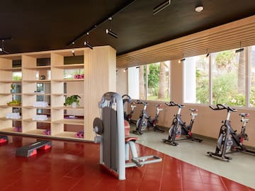 a room with exercise bikes and exercise equipment