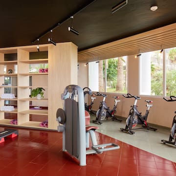 a room with exercise bikes and exercise equipment