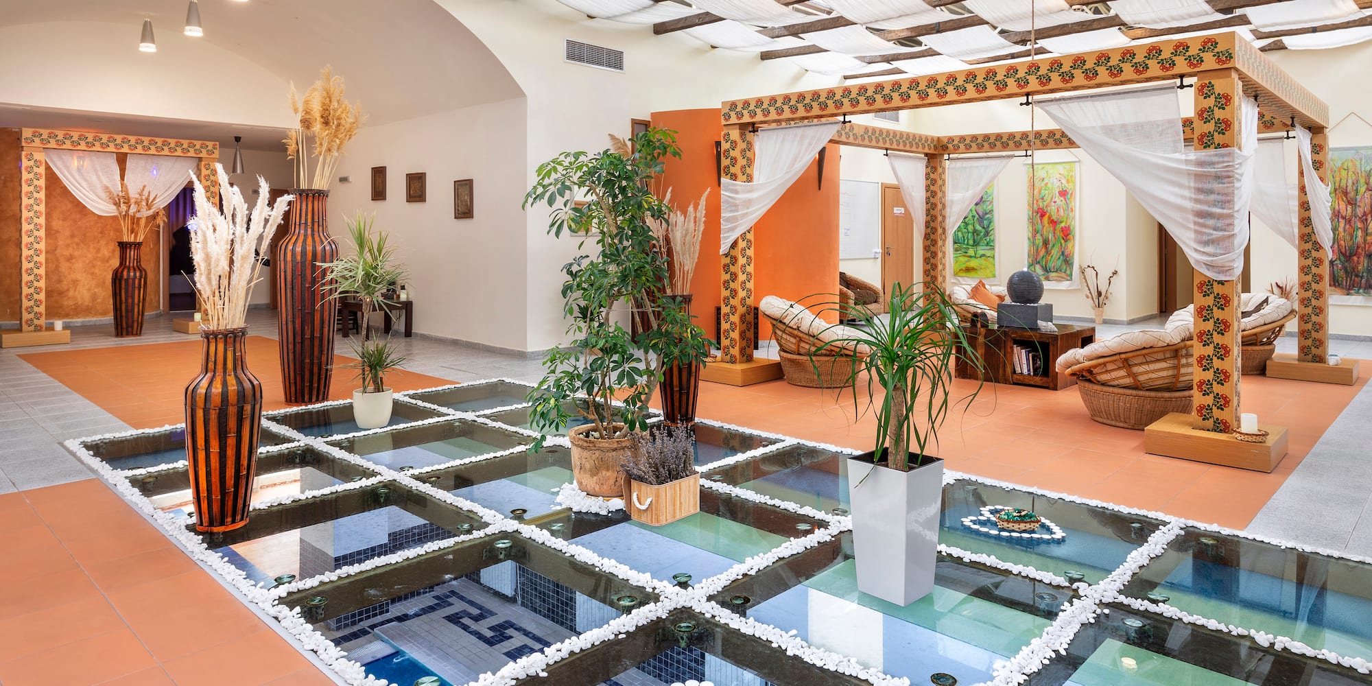 a room with a glass floor and plants