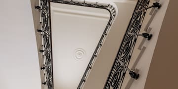 a staircase with a black railing