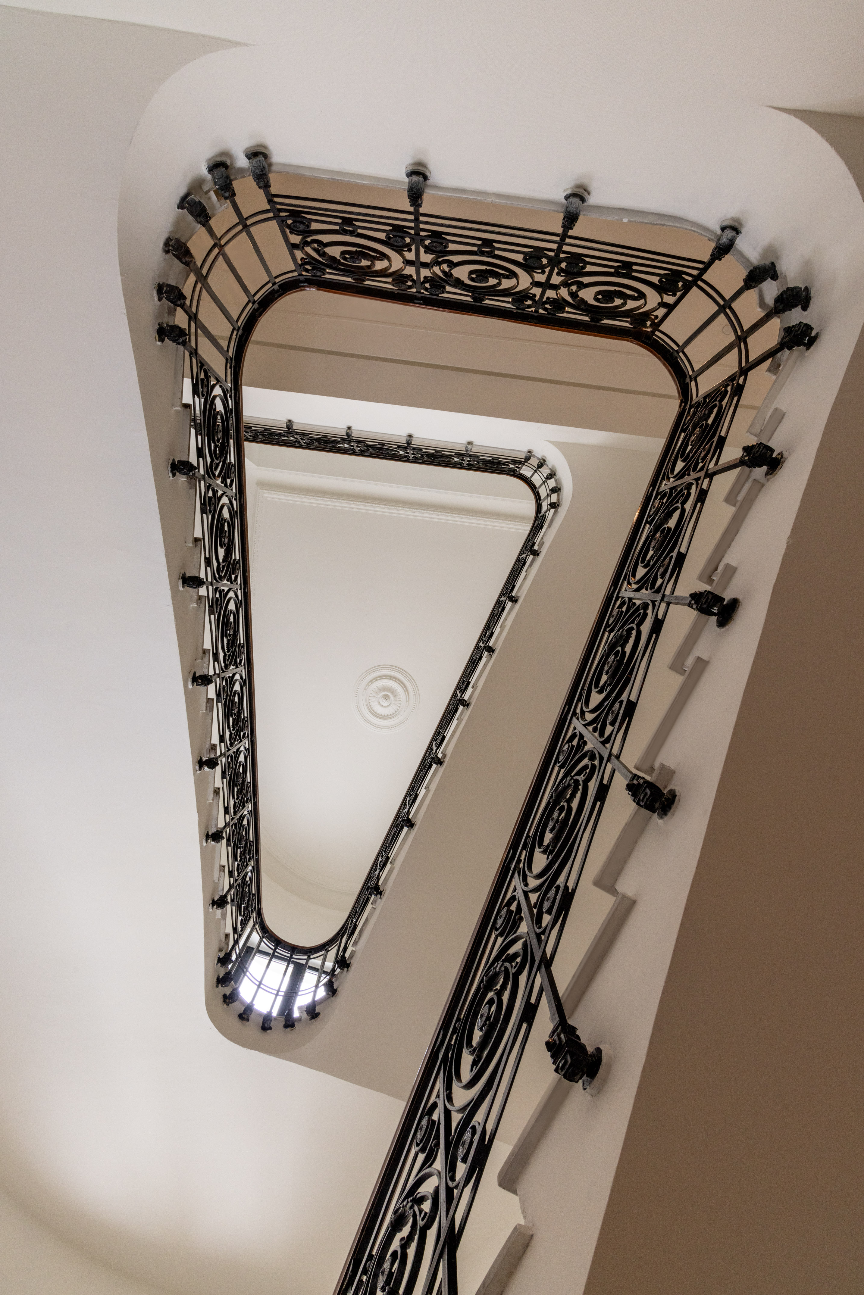 a staircase with a black railing